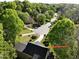 Aerial view of a neighborhood with lush greenery, showcasing the homes and streets at 141 Clay Ridge Way, Holly Springs, NC 27540