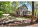 Expansive backyard with a wooden deck and fence, offering privacy and space for outdoor activities at 141 Clay Ridge Way, Holly Springs, NC 27540