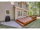 Outdoor deck with grill and patio with room for seating at 141 Clay Ridge Way, Holly Springs, NC 27540