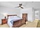 Comfortable bedroom featuring a ceiling fan, carpet, and wooden dresser at 141 Clay Ridge Way, Holly Springs, NC 27540