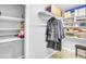 Organized closet features built-in shelving and ample storage space at 141 Clay Ridge Way, Holly Springs, NC 27540