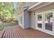 Wooden deck area adjacent to French doors, providing seamless indoor-outdoor living at 141 Clay Ridge Way, Holly Springs, NC 27540