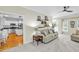 Cozy living room featuring a plush sofa, fireplace and built-in shelves at 141 Clay Ridge Way, Holly Springs, NC 27540