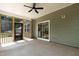 Exterior back porch with screened-in area, patio, and exterior green siding at 1412 Sagamore Dr, Louisburg, NC 27549