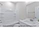 Bathroom with shower-tub combo and vanity with white quartz countertop at 1412 Sagamore Dr, Louisburg, NC 27549