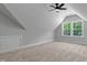 Upstairs bedroom featuring high ceilings and large windows at 1412 Sagamore Dr, Louisburg, NC 27549