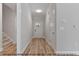 Bright entryway featuring hardwood flooring, neutral walls, and white trim at 1412 Sagamore Dr, Louisburg, NC 27549