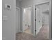 Hallway view showcasing neutral walls, carpeted floors, and doorway views into other rooms at 1412 Sagamore Dr, Louisburg, NC 27549