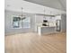 Well lit open kitchen featuring white cabinets, a kitchen island, and stainless steel appliances at 1412 Sagamore Dr, Louisburg, NC 27549