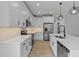Kitchen features white cabinets, granite countertops and stainless-steel appliances at 1412 Sagamore Dr, Louisburg, NC 27549