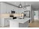 Modern kitchen featuring white cabinetry, stainless steel appliances, and a kitchen island at 1412 Sagamore Dr, Louisburg, NC 27549