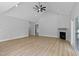 Open living room featuring vaulted ceilings, a fireplace, and recessed lighting at 1412 Sagamore Dr, Louisburg, NC 27549