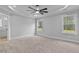 Spacious main bedroom with neutral paint, tray ceilings, and natural light at 1412 Sagamore Dr, Louisburg, NC 27549