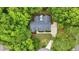 An aerial view of a beautiful single-Gathering house nestled among mature trees, with a private backyard at 146 Bennett Pl, Clayton, NC 27527