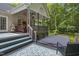 Inviting back deck with covered patio, hot tub, and stylish outdoor seating for relaxing and entertaining at 146 Bennett Pl, Clayton, NC 27527
