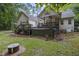 Home's backyard showcasing a hot tub, patio, and well-maintained outdoor space for relaxation at 146 Bennett Pl, Clayton, NC 27527