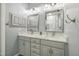 Bathroom with double sinks, grey cabinets, and modern fixtures at 146 Bennett Pl, Clayton, NC 27527