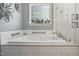 Bathroom showing a bathtub and shower behind a glass partition at 146 Bennett Pl, Clayton, NC 27527