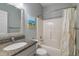 Bathroom featuring granite counter, white cabinet, and framed mirror at 146 Bennett Pl, Clayton, NC 27527