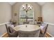 Cozy dining room with vaulted ceiling, chandelier, large window, and seating for four at 146 Bennett Pl, Clayton, NC 27527