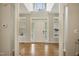 Spacious foyer with hardwood floors and large windows provides a bright, inviting entryway at 146 Bennett Pl, Clayton, NC 27527