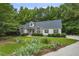 Charming single-Gathering home with lush landscaping, mature trees, and a well-manicured lawn at 146 Bennett Pl, Clayton, NC 27527