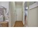 Hallway with laundry room, door to the backyard, and kitchen access at 146 Bennett Pl, Clayton, NC 27527