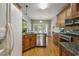 Charming kitchen with stainless appliances, granite counters, hardwood floors, and ample cabinet space at 146 Bennett Pl, Clayton, NC 27527
