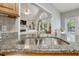 Granite kitchen countertop with stainless steel sink and faucet with an open view to the living room at 146 Bennett Pl, Clayton, NC 27527