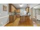 Well-lit kitchen with wooden cabinets, granite countertops and stainless steel appliances at 146 Bennett Pl, Clayton, NC 27527