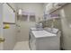 Laundry room with washer, dryer, and wire shelving at 146 Bennett Pl, Clayton, NC 27527