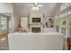 This open living room features built-in shelving, hardwood floors, and fireplace at 146 Bennett Pl, Clayton, NC 27527