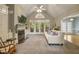 Cozy living room features a fireplace, built-in shelves, and a cathedral ceiling with fan at 146 Bennett Pl, Clayton, NC 27527