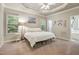 Spacious main bedroom with ensuite bathroom, tray ceiling, plush carpet, and windows with a view at 146 Bennett Pl, Clayton, NC 27527