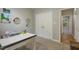 Well-lit office space with a closet and doorway. The room is painted in neutral colors at 146 Bennett Pl, Clayton, NC 27527