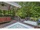 Spacious outdoor patio with comfortable seating, a grill, and views of lush greenery, ideal for relaxation at 146 Bennett Pl, Clayton, NC 27527