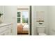 Bright bathroom with a view to a well-decorated bedroom, and a stylish, efficient toilet at 1538 Crescent Townes Way, Raleigh, NC 27604