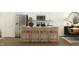 Contemporary kitchen featuring stainless appliances, island with seating, and white cabinetry at 1538 Crescent Townes Way, Raleigh, NC 27604