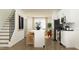 Modern kitchen with stainless steel appliances, island seating, and hardwood floors at 1538 Crescent Townes Way, Raleigh, NC 27604