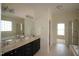 Elegant bathroom featuring double sinks, a large mirror, and a separate shower and tub at 1549 Lily Creek Dr, Cary, NC 27518