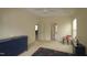 Bright bedroom featuring a ceiling fan, plush carpeting, and a decorative chair at 1549 Lily Creek Dr, Cary, NC 27518