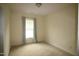 Empty bedroom featuring a window, neutral carpeting, and freshly painted walls at 1549 Lily Creek Dr, Cary, NC 27518