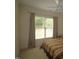 Bright bedroom with large windows offering a pleasant view and letting in natural light at 1549 Lily Creek Dr, Cary, NC 27518