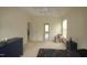 Bright bedroom featuring a ceiling fan, plush carpeting, and a decorative chair at 1549 Lily Creek Dr, Cary, NC 27518