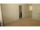 Bright bedroom features neutral carpeting, with a view of the ensuite bathroom and hallway beyond at 1549 Lily Creek Dr, Cary, NC 27518