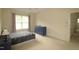 Bright bedroom featuring a large window and a blue dresser at 1549 Lily Creek Dr, Cary, NC 27518