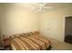 Comfortable bedroom features neutral walls, ceiling fan, and carpet at 1549 Lily Creek Dr, Cary, NC 27518