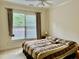 Bedroom featuring a large window and a comfortable bed, creating a relaxing atmosphere at 1549 Lily Creek Dr, Cary, NC 27518