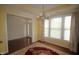 Dining room showcasing a large window, wood floors, chandelier, and decorative rug at 1549 Lily Creek Dr, Cary, NC 27518
