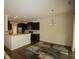 Open concept living area with kitchen view, hardwood floors and dining area at 1549 Lily Creek Dr, Cary, NC 27518